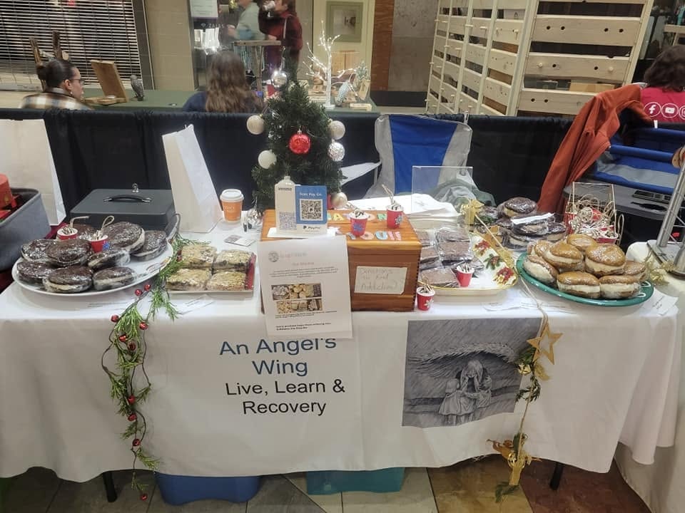 An Angel's Wing community event display table