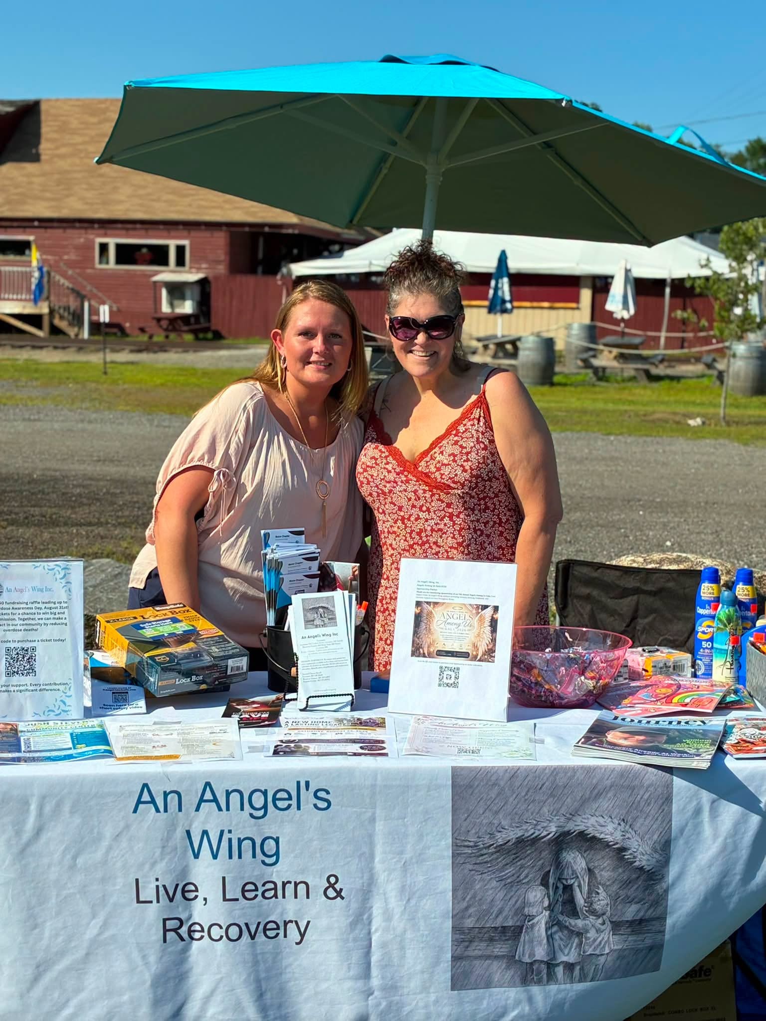 An Angel's Wing outreach table at a community event