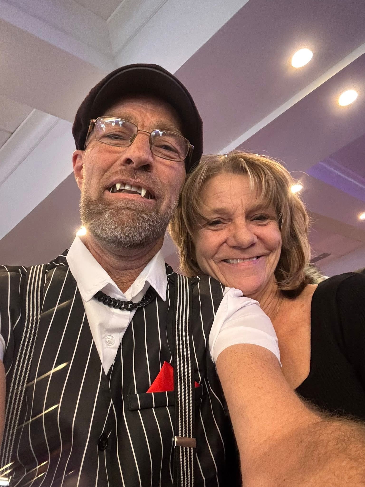 Angels Among Us Gala — two people smiling at indoor event