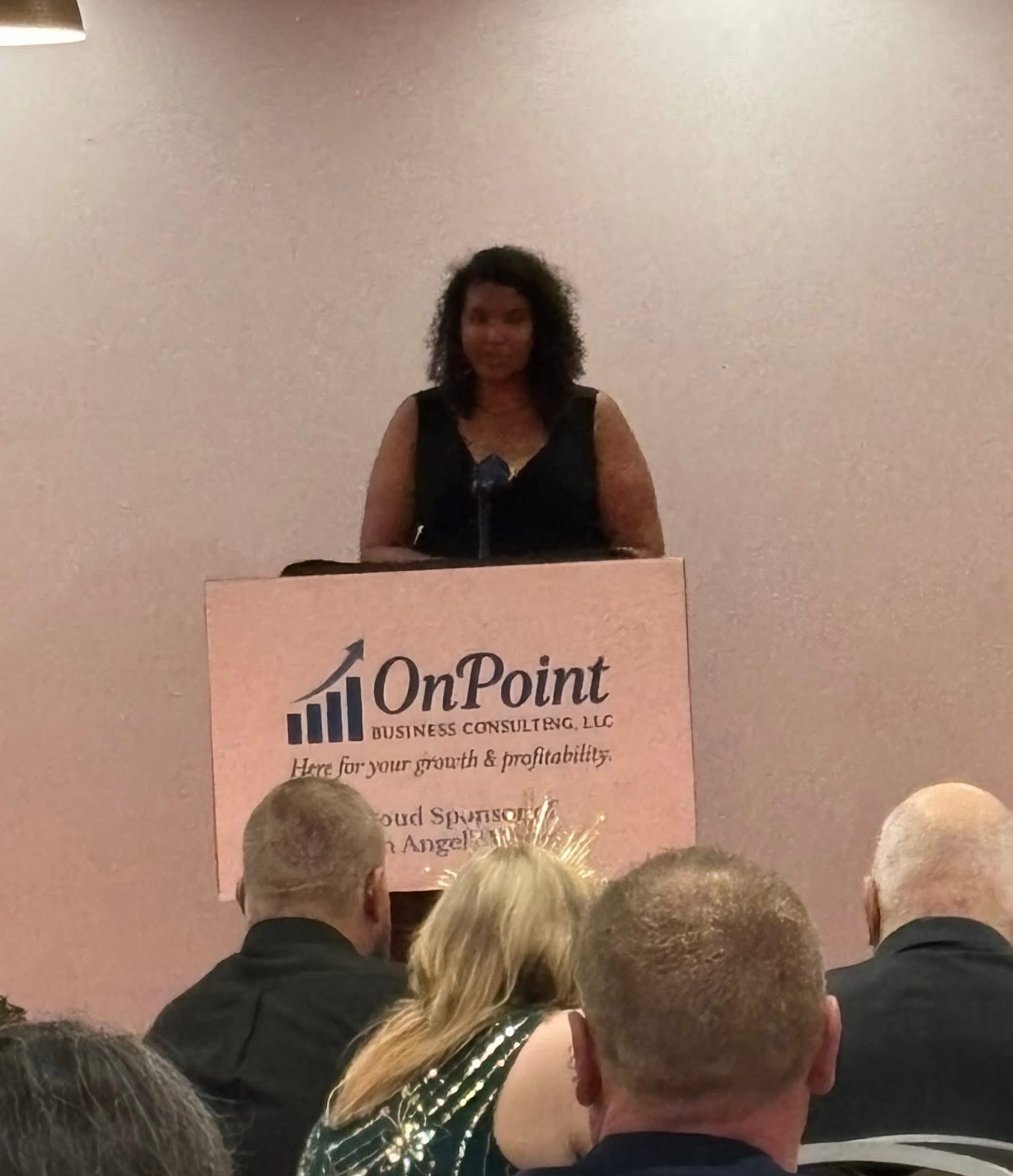 Angels Among Us Gala — speaker at podium